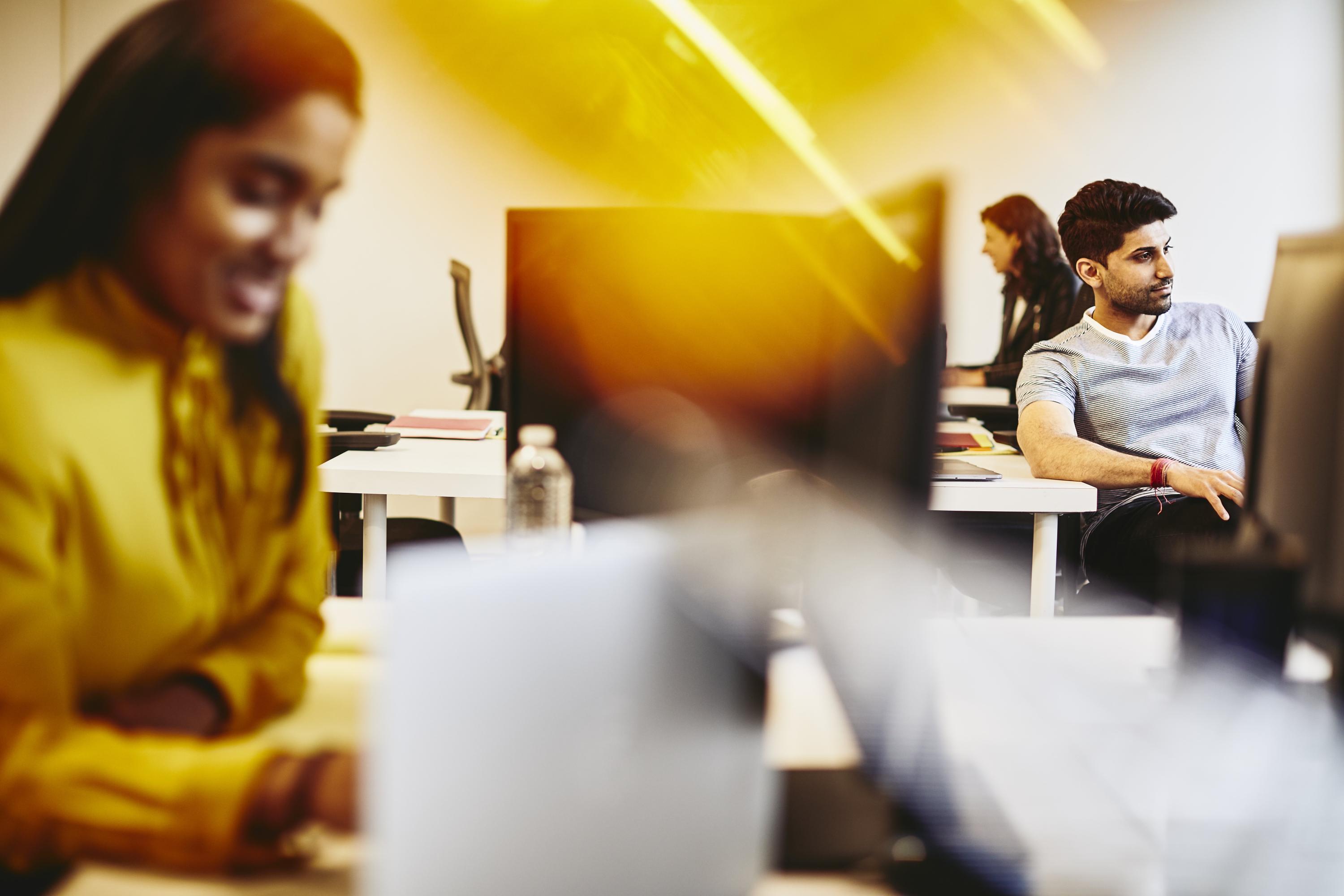 Man and women working in an office